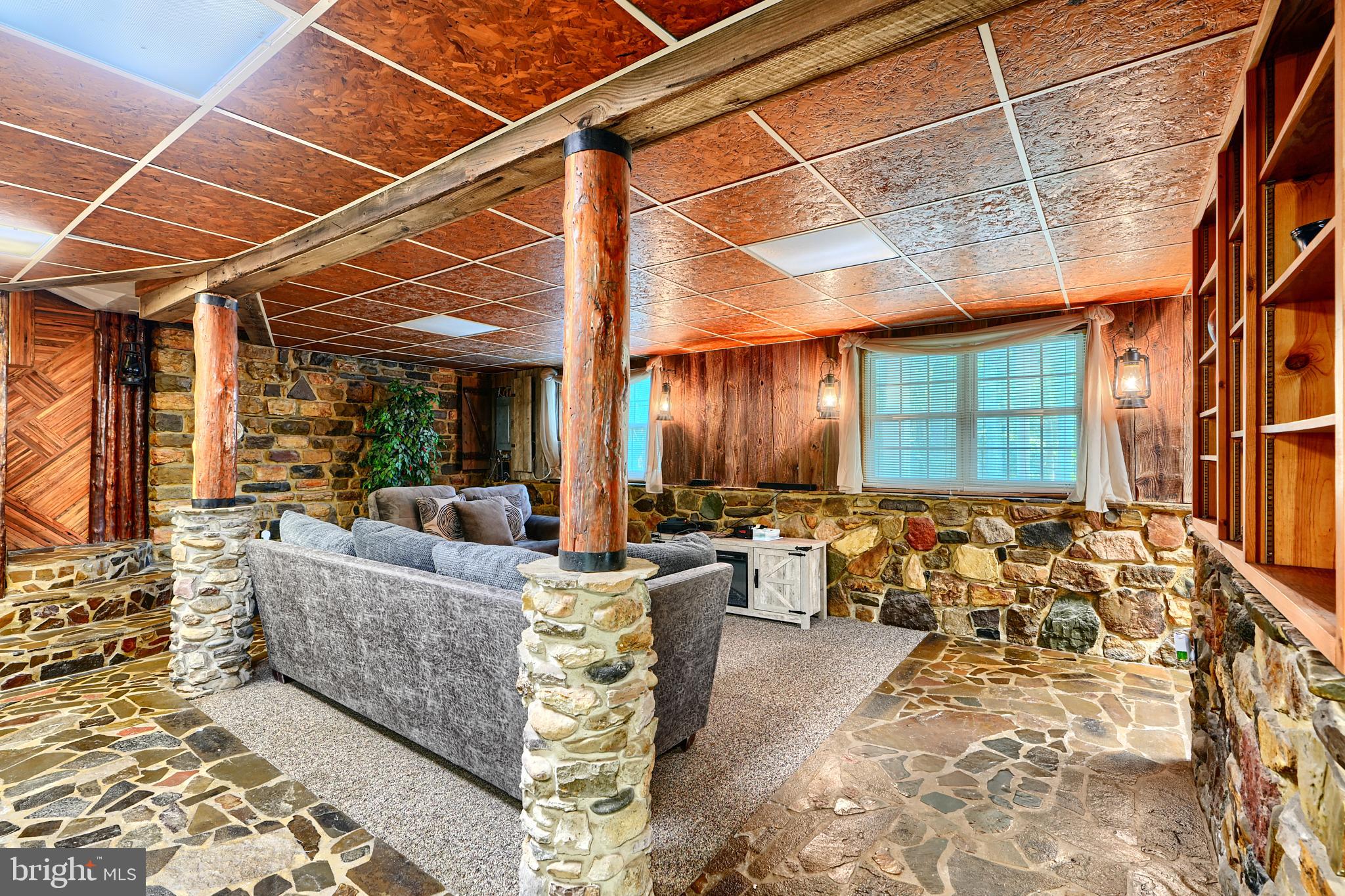 6065 Poplar Road St. Leonard, MD 20685 - Photo 42 of 50 a living room with furniture and a ceiling fan