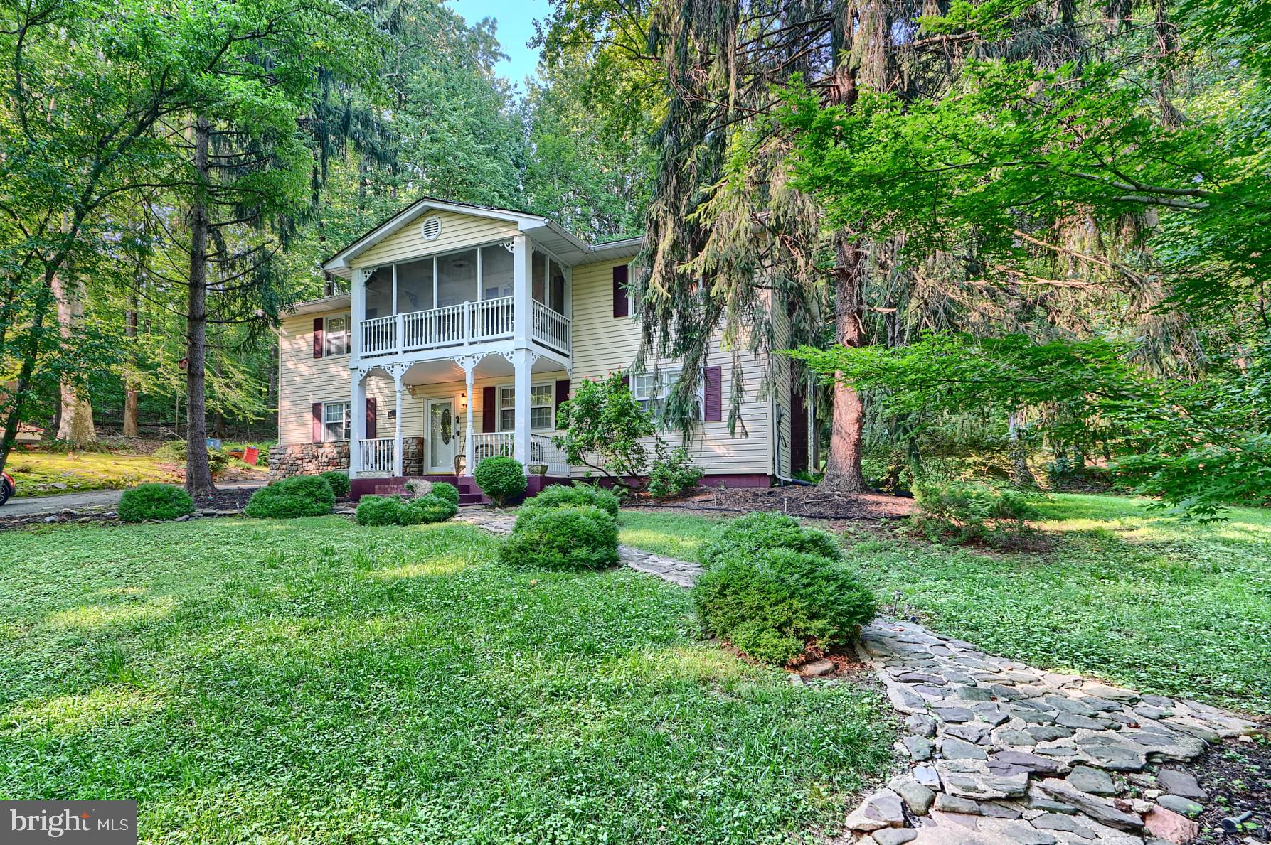 6065 Poplar Road St. Leonard, MD 20685 - Photo 48 of 50 a front view of a house with a yard