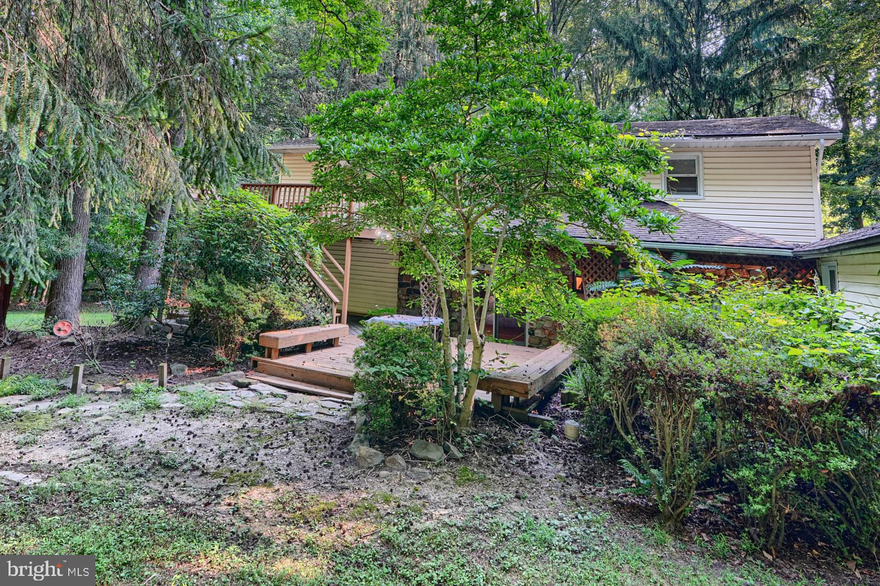 6065 Poplar Road St. Leonard, MD 20685 - Photo 49 of 50 a view of a house with a yard and sitting area