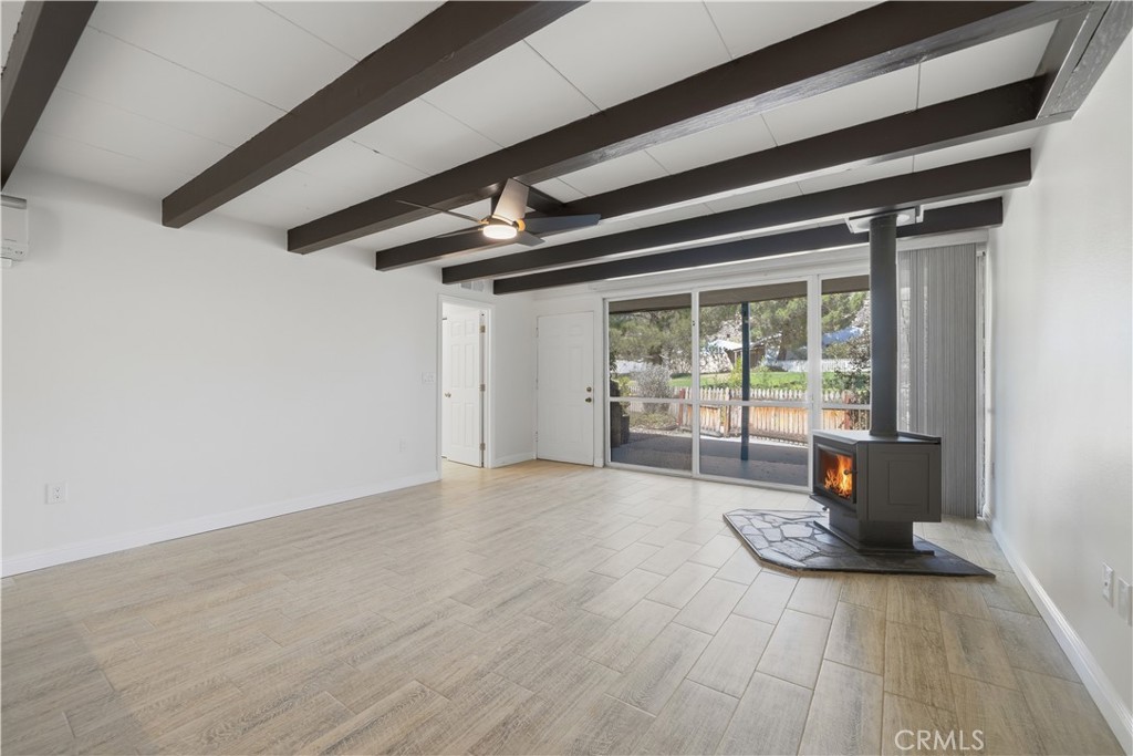 600 Gibbel Road Hemet, CA 92543 - Photo 11 of 28 Alternate view of living room w front yard and community green belt visible thru the floor to ceiling windows
