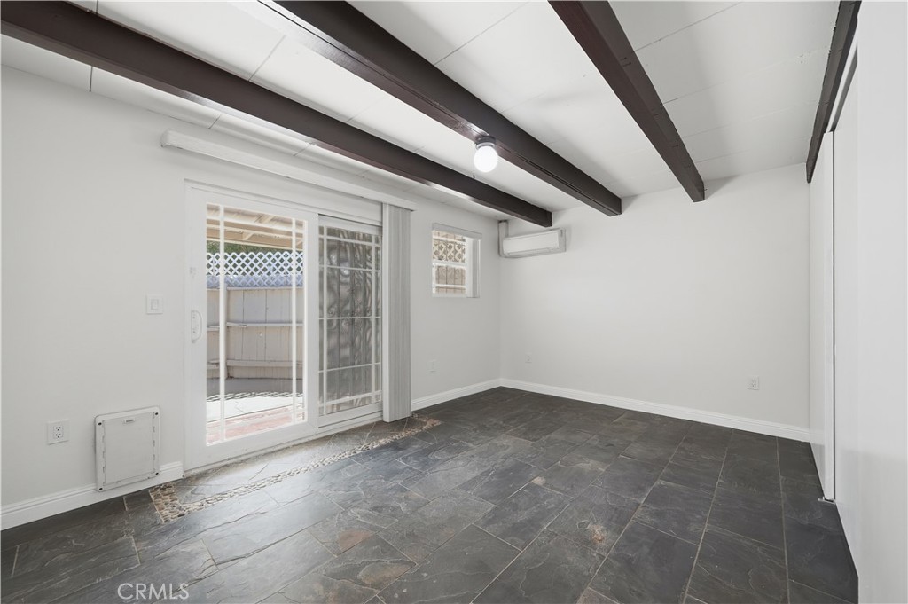 600 Gibbel Road Hemet, CA 92543 - Photo 17 of 28 Bedroom 2 w slate flooring, all new paint and dual pane sliding doors leading to the enclosed back patio area.