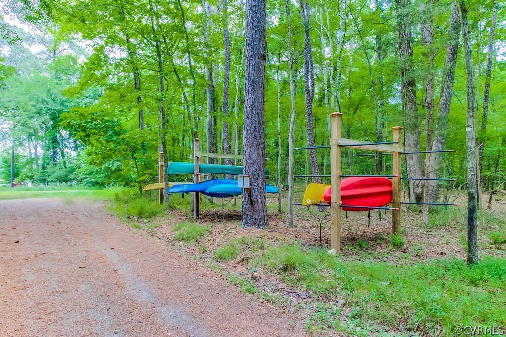 3901 Old Gun Road West Midlothian, VA 23113 - Photo 8 of 16 a backyard of a house with barbeque oven fire pit table and chairs