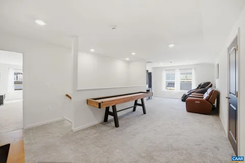 a living room with furniture a table and a flat screen tv