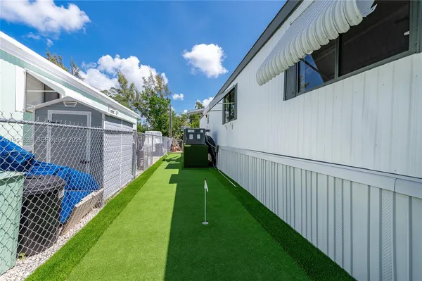 a view of a swimming pool with a patio
