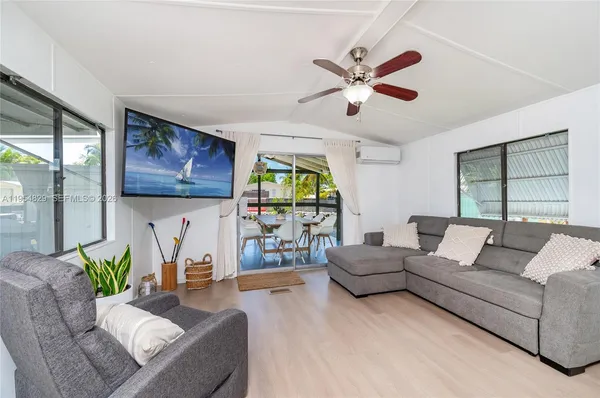 a living room with furniture and a clock