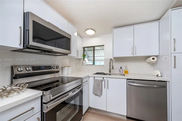 a view of a hallway with paintings on the wall