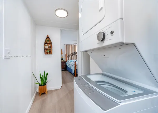 a bathroom with a sink and mirror with toilet