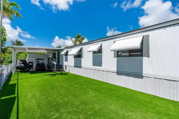 a view of a chair and tables in the patio