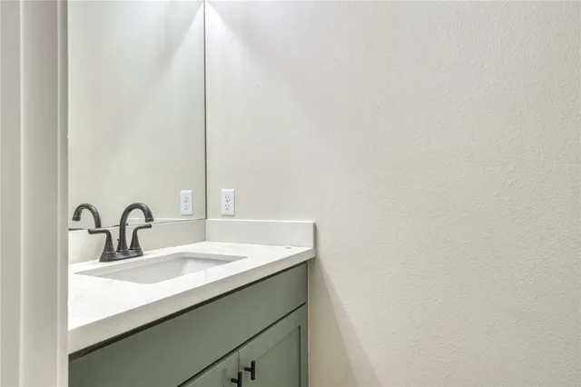 a close up of a sink and a mirror