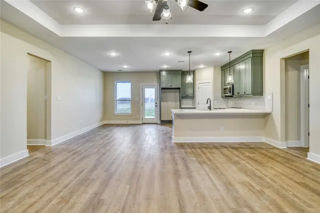 a view of an entryway of a house and livingroom with furniture