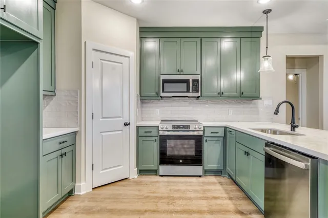 a spacious bathroom with a sink and a mirror