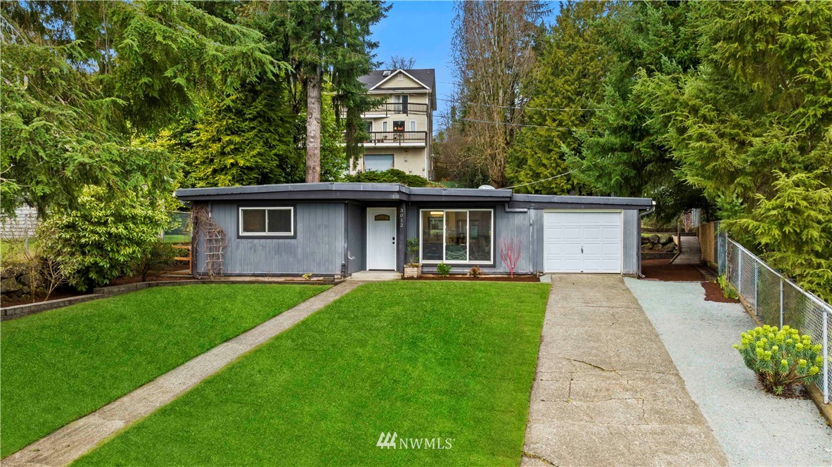 3012 Southwest 102nd Street Seattle, WA 98146 - Photo 1 of 32 a front view of a house with a garden