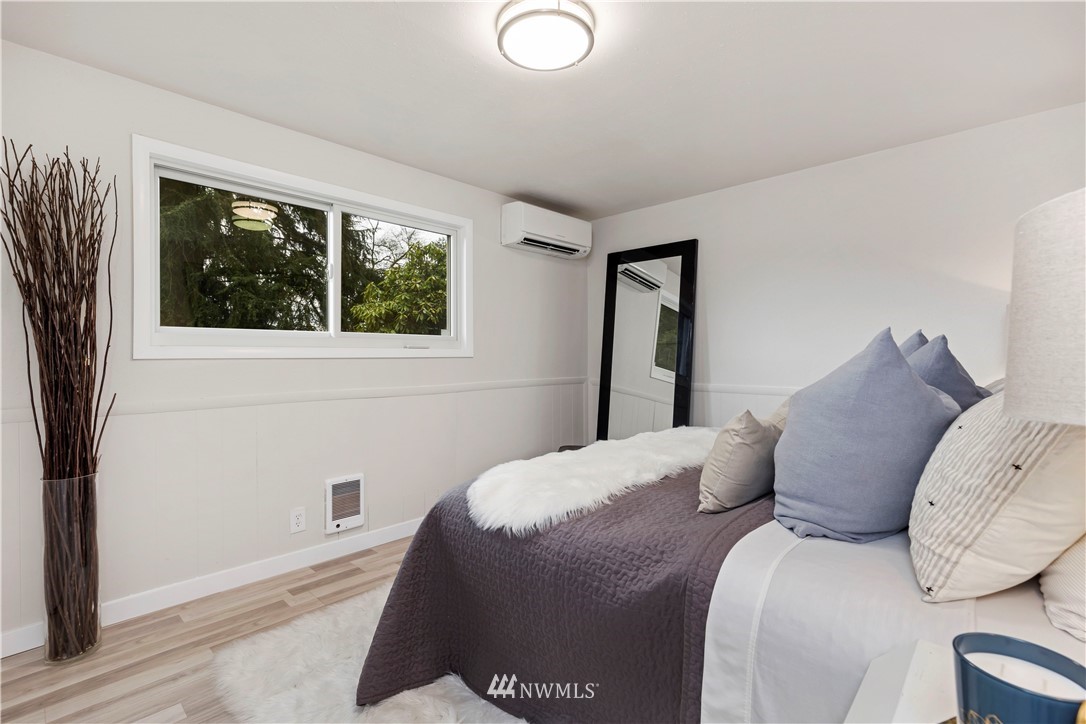 3012 Southwest 102nd Street Seattle, WA 98146 - Photo 20 of 32 a bedroom with a bed and window