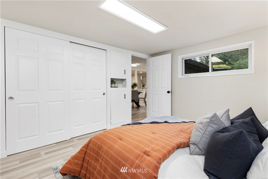 3012 Southwest 102nd Street Seattle, WA 98146 - Photo 25 of 32 a bedroom with a bed and a window