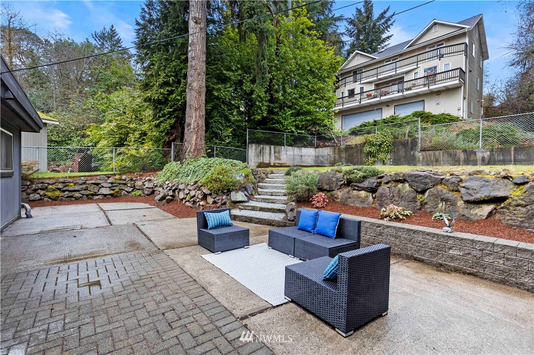 3012 Southwest 102nd Street Seattle, WA 98146 - Photo 27 of 32 a view of a patio with couches and potted plants