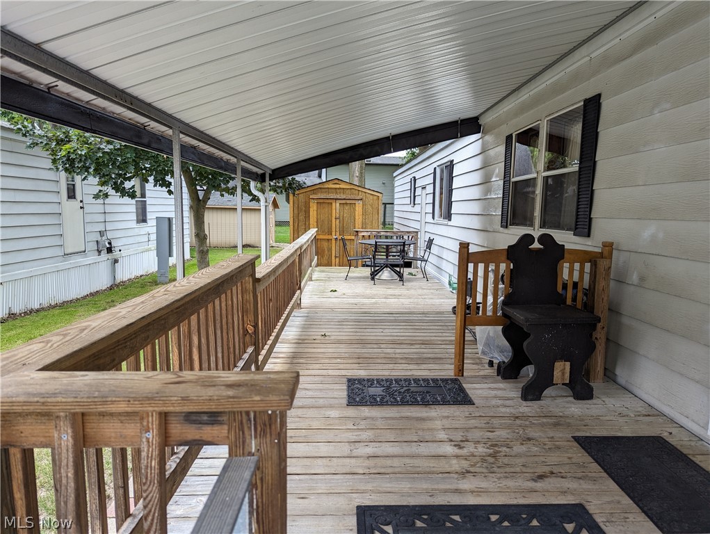 35157 Center Ridge Road, Unit 112 North Ridgeville, OH 44039 - Photo 3 of 9 Wooden deck with a storage unit