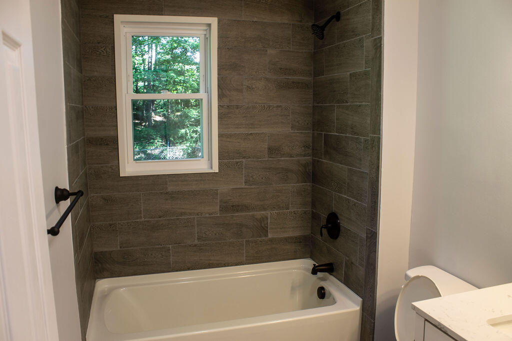4438 Windsor Spring Road Hephzibah, GA 30815 - Photo 11 of 23 There is a full bath down stairs.