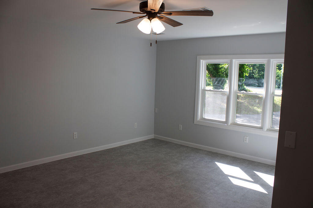 4438 Windsor Spring Road Hephzibah, GA 30815 - Photo 13 of 23 Enter from the carport door to find this great room/flex space.