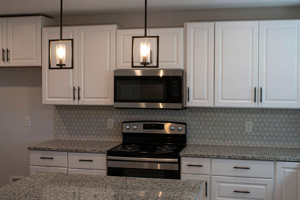 4438 Windsor Spring Road Hephzibah, GA 30815 - Photo 2 of 23 The updated kitchen has so much cabinet space!