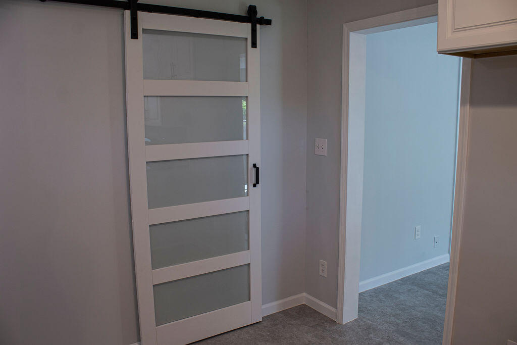 4438 Windsor Spring Road Hephzibah, GA 30815 - Photo 6 of 23 The barn door separates the kitchen from the laundry room.