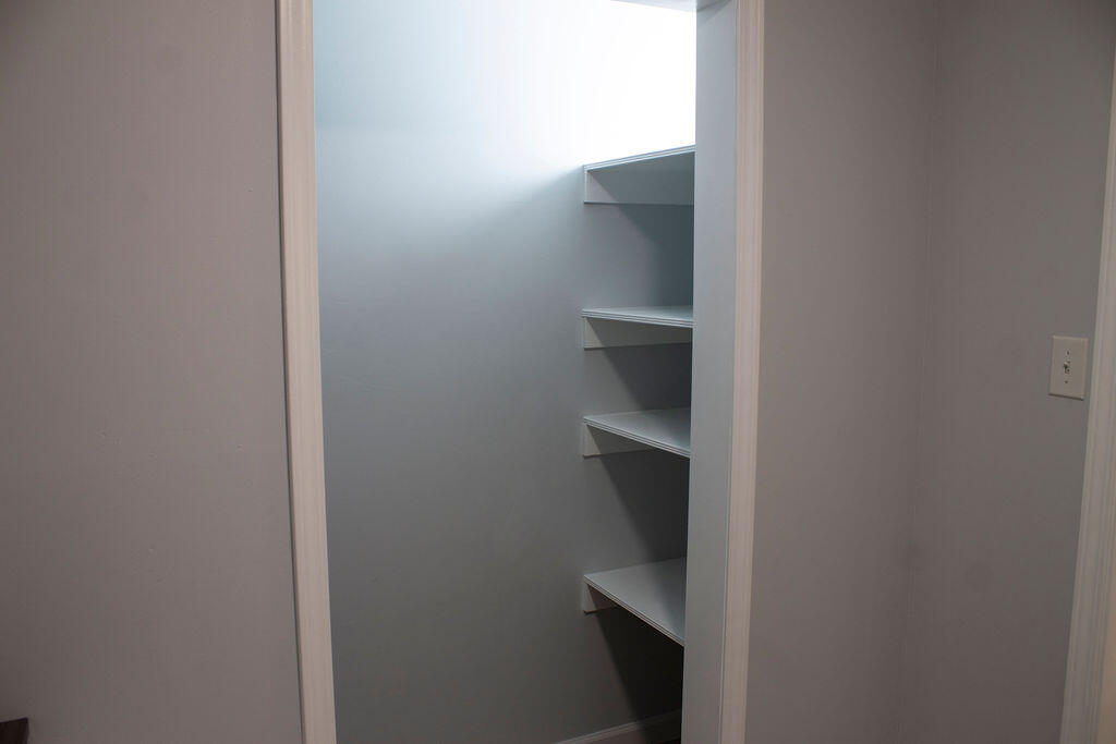 4438 Windsor Spring Road Hephzibah, GA 30815 - Photo 9 of 23 The pantry space is found inside the laundry room and has several shelves for all your organization needs.