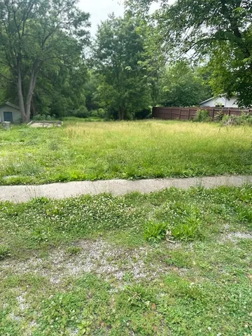 a view of a garden with a lake