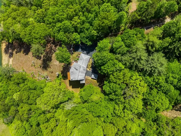 a backyard of a house with lots of green space