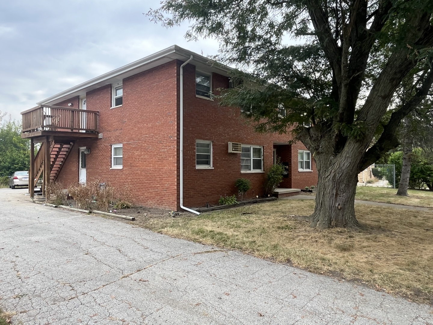 206 West Shelbourne Drive Normal, IL 61761 - Photo 2 of 3 a view of a house with a tree