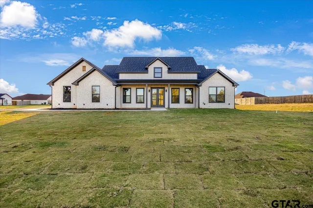 a view of a house with a big yard