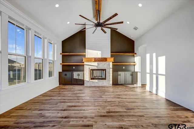 a view of a kitchen with microwave and cabinets