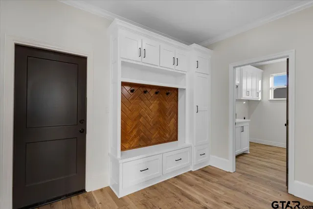 a view of room with window and wooden floor
