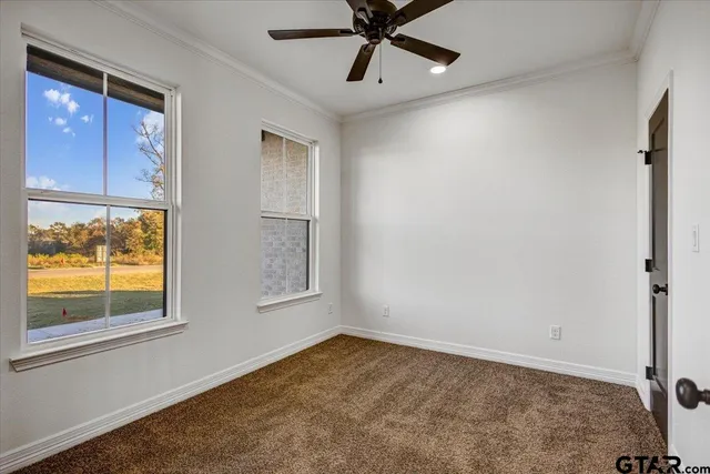 a view of an empty room and window