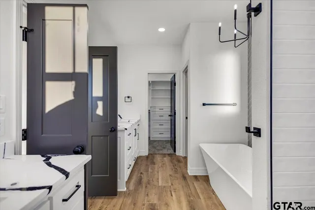 a bathroom with a bathtub sink and toilet