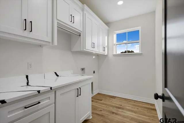 a kitchen with stainless steel appliances white cabinets and a sink