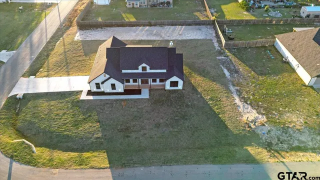 a aerial view of a house with swimming pool