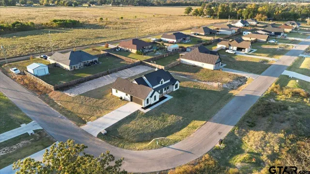 an aerial view of a house with a ocean view