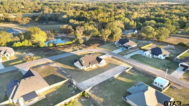 an aerial view of a house with a ocean view
