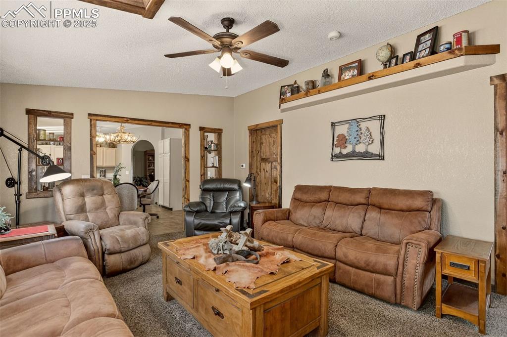 50 Rd P78 Bailey, CO 80421 - Photo 11 of 49 a living room with furniture ceiling fan and a rug