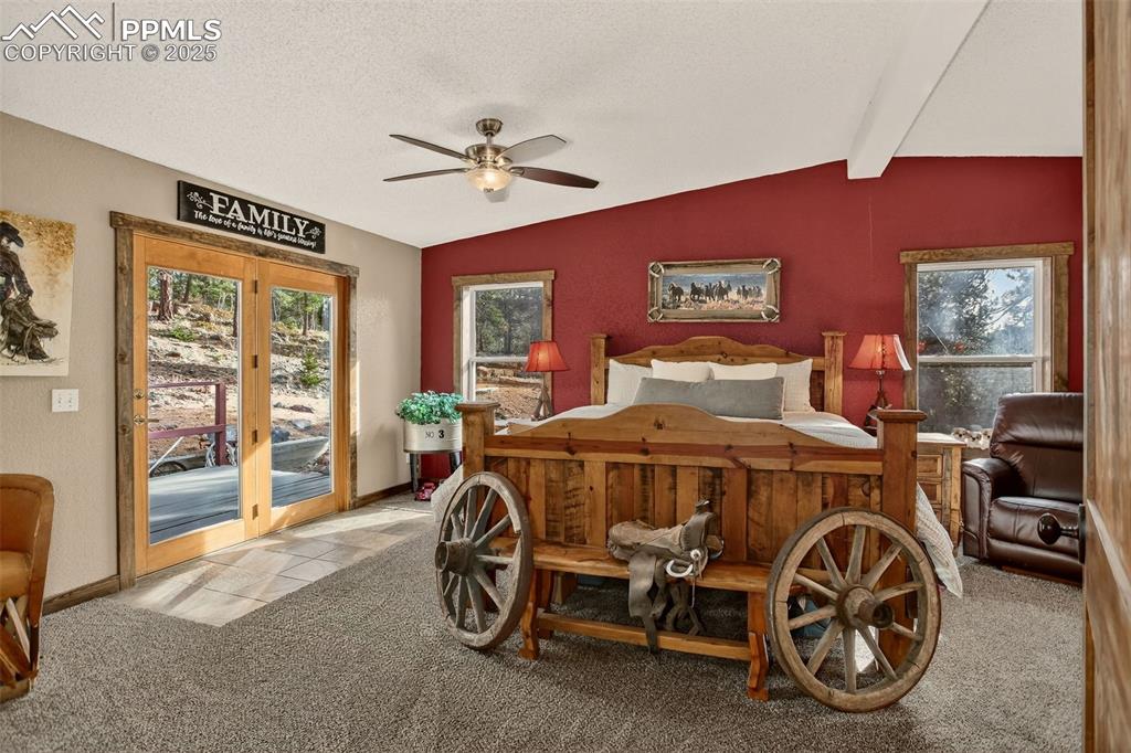 50 Rd P78 Bailey, CO 80421 - Photo 14 of 49 a bedroom with a bed and a chandelier
