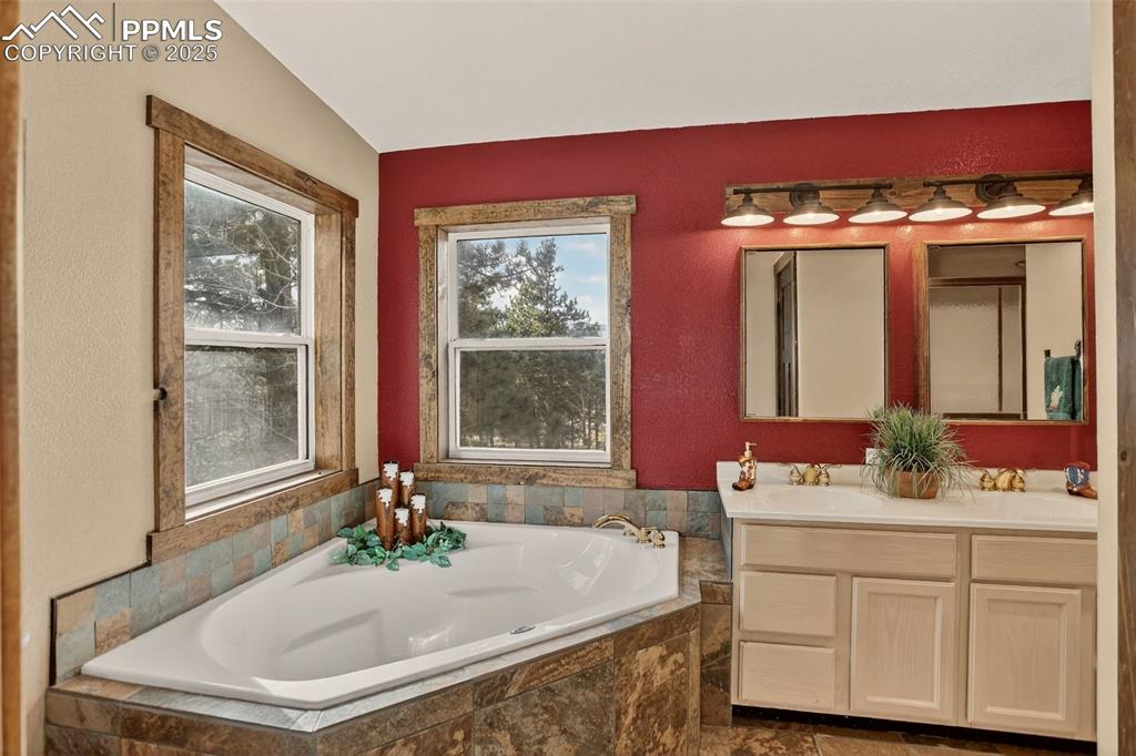 50 Rd P78 Bailey, CO 80421 - Photo 16 of 49 a bathroom with a tub sink and mirror