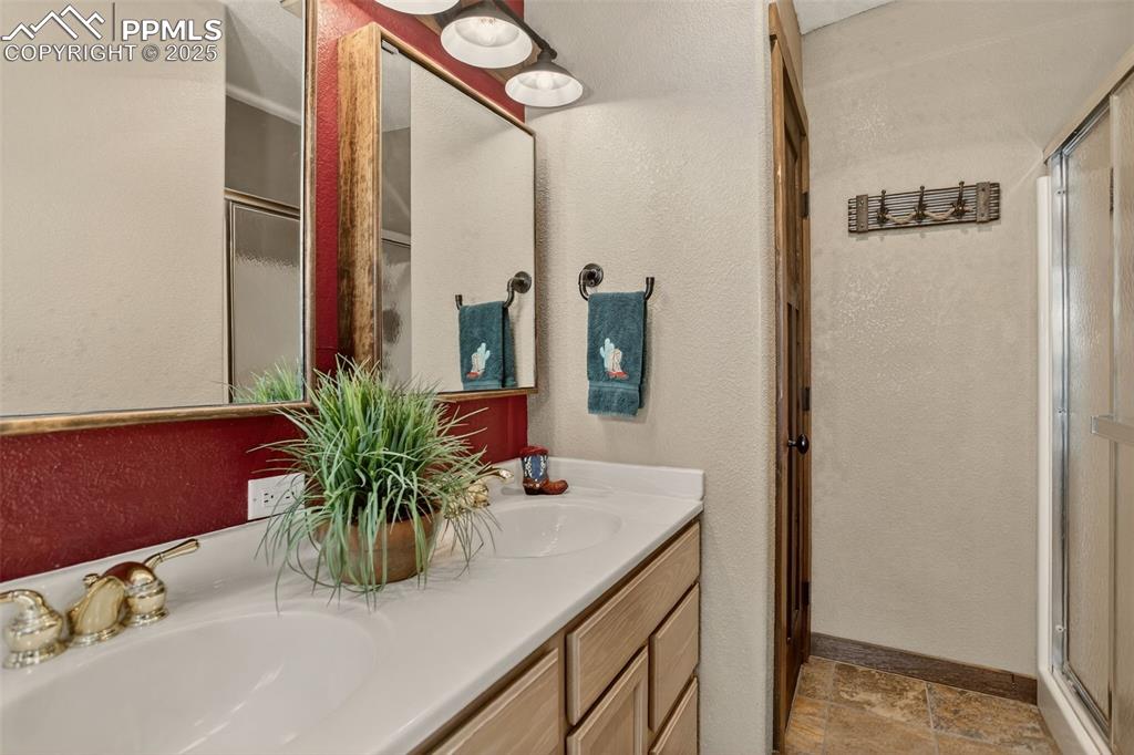 50 Rd P78 Bailey, CO 80421 - Photo 17 of 49 a bathroom with a sink a mirror and a potted plant