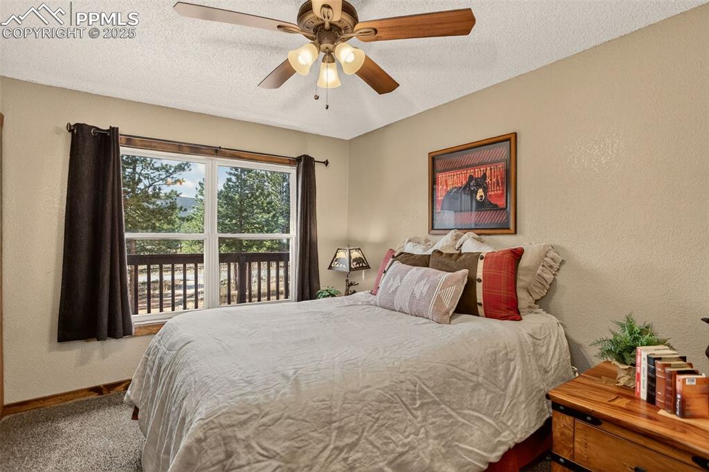 50 Rd P78 Bailey, CO 80421 - Photo 19 of 49 a bedroom with a large bed and a large window