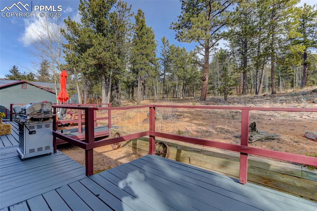 50 Rd P78 Bailey, CO 80421 - Photo 24 of 49 a view of a wooden deck with a bench