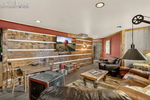 a living room with furniture and a floor to ceiling window