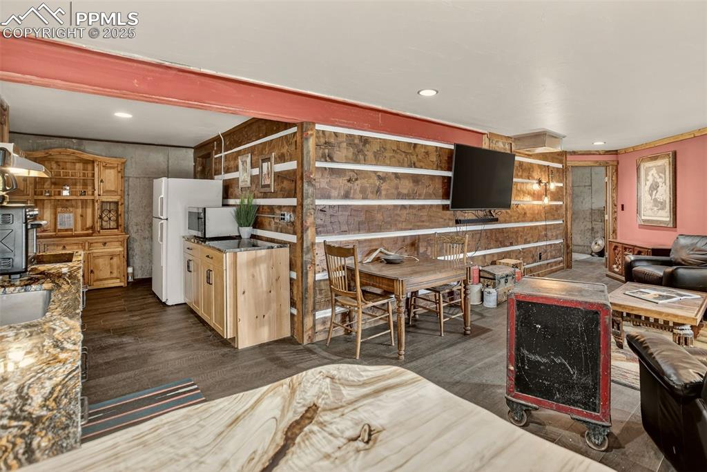 50 Rd P78 Bailey, CO 80421 - Photo 35 of 49 a room with furniture a flat screen tv and kitchen view