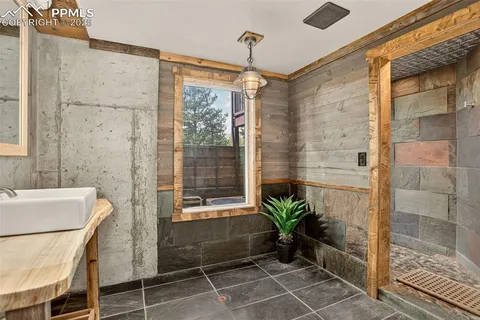 a bathroom with a glass shower door