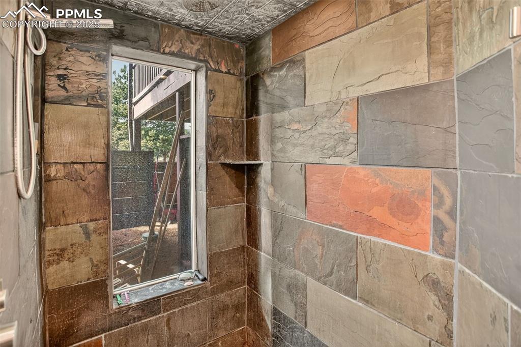 50 Rd P78 Bailey, CO 80421 - Photo 42 of 49 a bathroom with a glass shower door