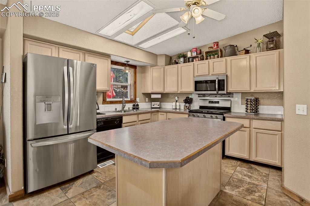 50 Rd P78 Bailey, CO 80421 - Photo 8 of 49 a kitchen with kitchen island a counter appliances and cabinets