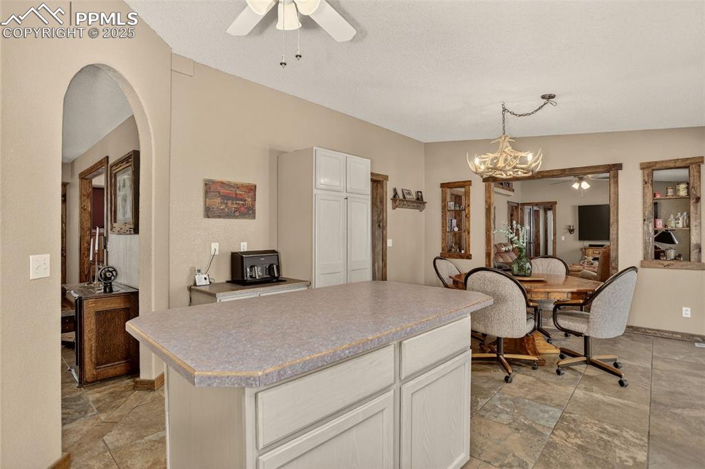 50 Rd P78 Bailey, CO 80421 - Photo 9 of 49 a view of kitchen island with furniture and chandelier