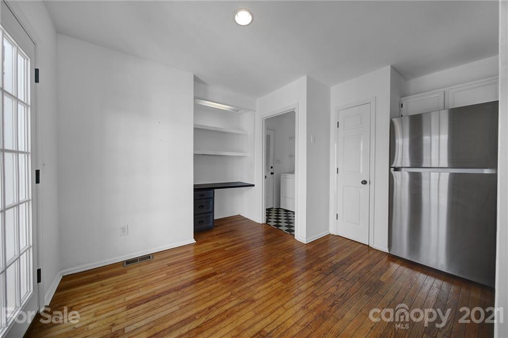 7032 Cambridge Circle Tega Cay, SC 29708 - Photo 11 of 36 a view of empty room with wooden floor